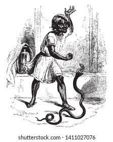 A Hindu snake charmer, vintage line drawing or engraving illustration