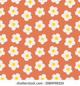 Hippie floral daze ditsy daisy seamless repeat pattern. Retro, vector botany millefleurs all over surface print on orange background.