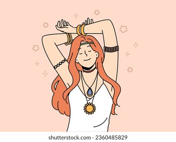 Hippie woman with amulet and bracelets on hands closes eyes, feeling pleasure or euphoria, and slowly dances with hands up. Red-haired young girl bows to hippie or woodstock subculture