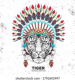 Hipster animal tiger with indian feather headdress. Hand drawing Muzzle of animal tiger