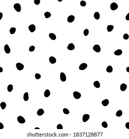 Hipster black and white seamless polka dot pattern. Vector irregular abstract texture with random hand drawn spots.