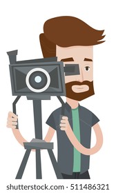 Hipster cameraman looking through movie camera on a tripod. Cameraman with professional video camera. Young cameraman taking a video. Vector flat design illustration isolated on white background.
