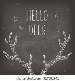 Hipster Christmas card with chalk deer antlers, chalkboard