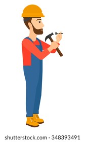 A hipster constructor with the beard hitting a nail with a hummer vector flat design illustration isolated on white background. Vertical layout.