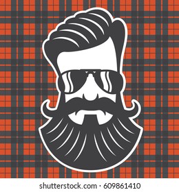 Hipster head on plaid background
Vector cartoon drawing of hipster with beard and moustache.