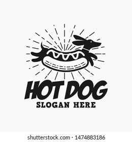 Hipster Hot Dog Logo. a wiener in bun with sunburst