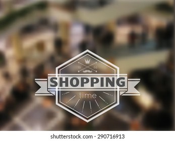 Hipster label with sopping time icon in the mall blurred background.