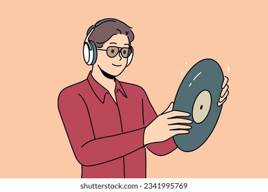 Hipster man with vinyl record listens to music in headphones, collecting retro discs with audio recordings. Guy looks at vinyl record and rejoices in buying rare copy with recording of concert