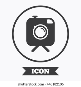 Hipster photo camera sign icon. Retro camera on tripod symbol. Graphic design element. Flat symbol in circle button. Vector