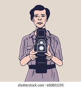 A hipster photographer holding a camera. Photographer using professional film camera. Vector flat design illustration isolated on background.