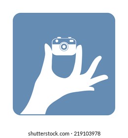 Hipster taking a self portrait with camera. Vector illustration. Flat design. Selfie concept. 