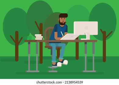 Hipster, der an einem Computer im Park arbeitet
