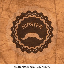 hipster's badge on the brown crumbled textured paper background