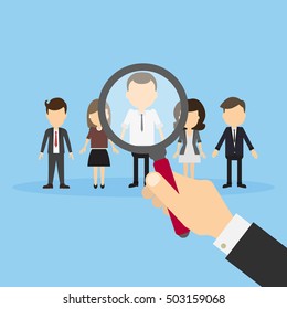 Hiring staff concept. Hand with magnifying glass finding and recruiting new worker.