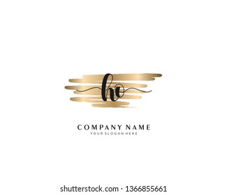 HO initial handwriting logo with brush gold color template vector