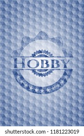 Hobby blue emblem or badge with geometric pattern background.