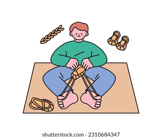 Hobby class. A boy is making traditional Korean straw shoes.