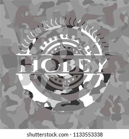 Hobby written on a grey camouflage texture