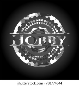 Hobby written on a grey camouflage texture