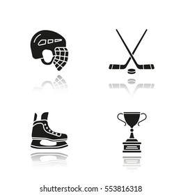 Hockey equipment drop shadow black icons set. Helmet, ice skate, sticks, winner's award. Isolated vector illustrations