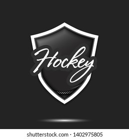 Hockey logo design template. Hockey emblem pattern. Hockey puck and shield with vintage lettering on an isolated background. Print on t-shirt graphics. Vector illustration