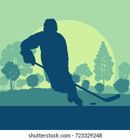 Hockey player on ice lake with stick landscape with snow trees vector background