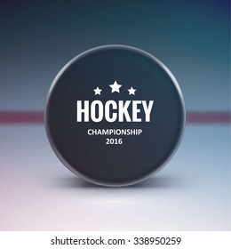 Hockey puck isolated on ice with blur 