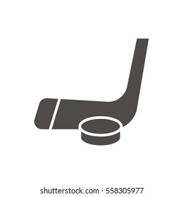 Hockey puck and stick icon. Ice hockey equipment. Silhouette symbol. Negative space. Vector isolated illustration