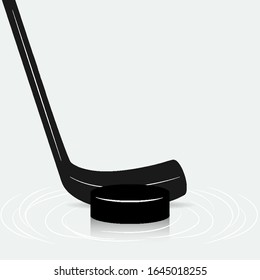Hockey stick and puck on ice, vector art illustration.