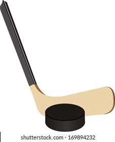 Hockey stick and puck in the vector