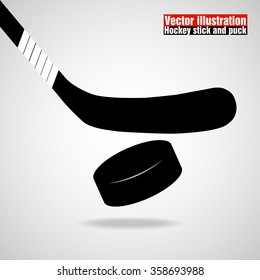 Hockey stick and puck. Vector illustration. Eps 10