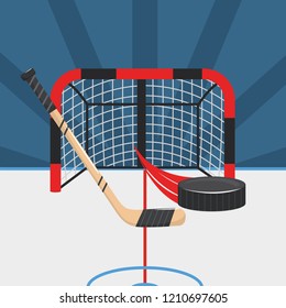 hockey sticks with puck and goal in the rink
