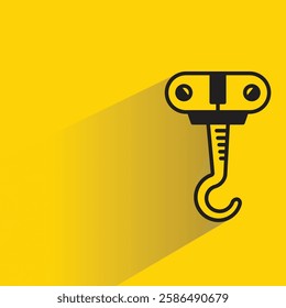 hoist crane hook icon with shadow on yellow background