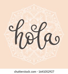 "Hola" hand drawn vector lettering in Spanish, which means "hello". Spanish greeting. Inspirational calligraphic quote. Hand written lettering. 