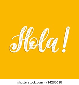 Hola hand lettering phrase translated from spanish Hello on yellow background.