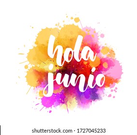 Hola Junio (Hello June in Spanish) -  handwritten modern calligraphy lettering on abstract watercolor imitation splash. 