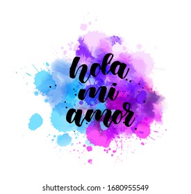 Hola mi amor - Hello my love in Italian language. Handwritten modern calligraphy lettering text on multicolored watercolor paint splash. Blue and purple colored.