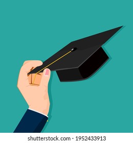 Hold a graduation cap in hand. Learning success