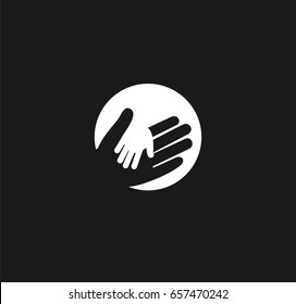 Holding Hand of a child in the hand of an adult vector logo. World Father Day. Symbol of care, kindness, family, children, parents. Light lantern ray hand shadow