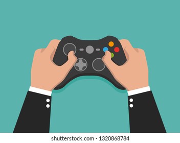 Holding in hands gamepad and playing videogame