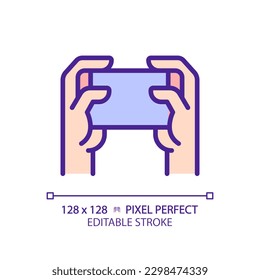 Holding smartphone with two hands pixel perfect RGB color icon. Playing video games. Comfortable device usage. Isolated vector illustration. Simple filled line drawing. Editable stroke