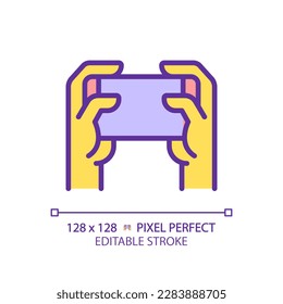 Holding smartphone with two yellow hands RGB color icon. Playing video games. Comfortable device usage. Communication technology. Isolated vector illustration. Simple filled line drawing