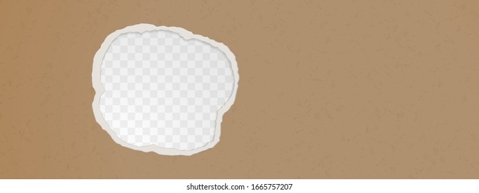 A hole in the ripped recycled paper background. Cardboard or paperboard kraft paper frame.
