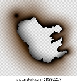 Hole torn in ripped paper with burnt and flame on transparent background