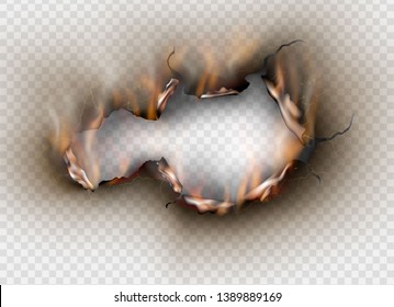 Hole torn in ripped paper with burnt and flame on transparent background