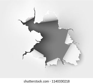 Hole torn in ripped paper on white background