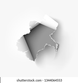 Hole torn in ripped paper on white background