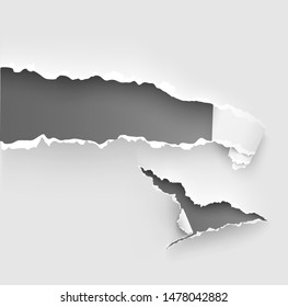 Hole torn in ripped paper on white background