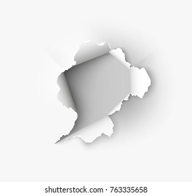 Hole torn in ripped paper on white