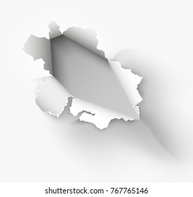 Hole torn in ripped paper on white background